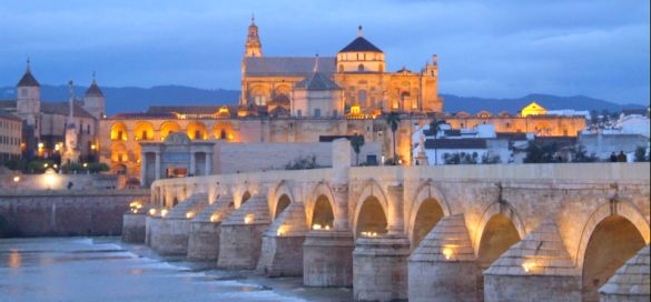 view of the mezquita and roman bridge cordoba spain