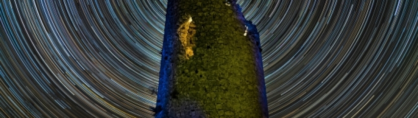 Moorish watchtower and startrail night sky photography Spain 